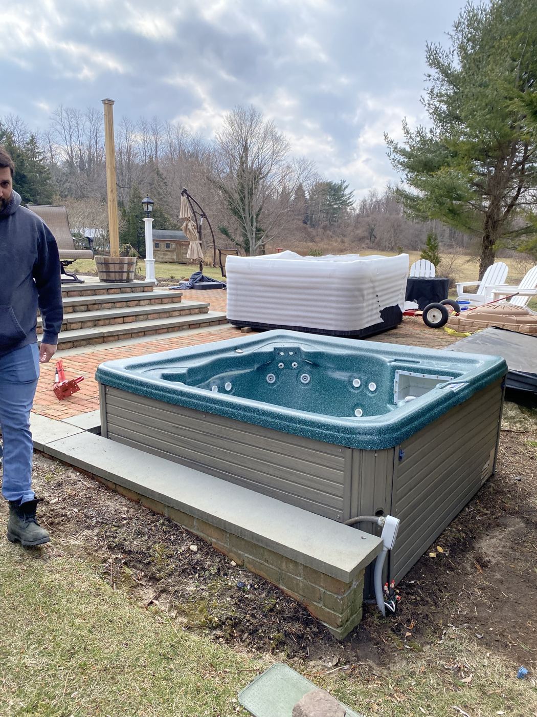 Old tub removed next to its replacement